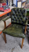 A reproduction green leather button back upholstered armchair Location: If there is no condition