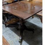 An early 19th century mahogany occasional table having a fluted column and three splayed legs 74cm h