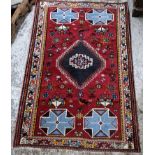 A Tabriz rug with geometric motifs 169cm x 110cm Location: If there is no condition report shown,