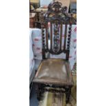A late Victorian oak carved hall chair, the top surmounted by lions and having barley twist supports