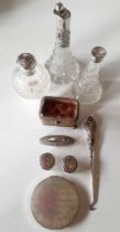 A quantity of early 20th century dressing table items to include silver and white metal topped glass