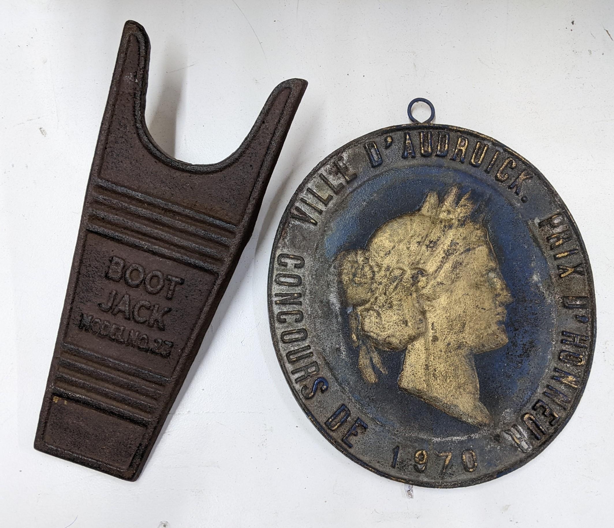 A painted cast iron plaque Ville d' Audrick Prix d'Honneur concours de 1970 and a reproduction