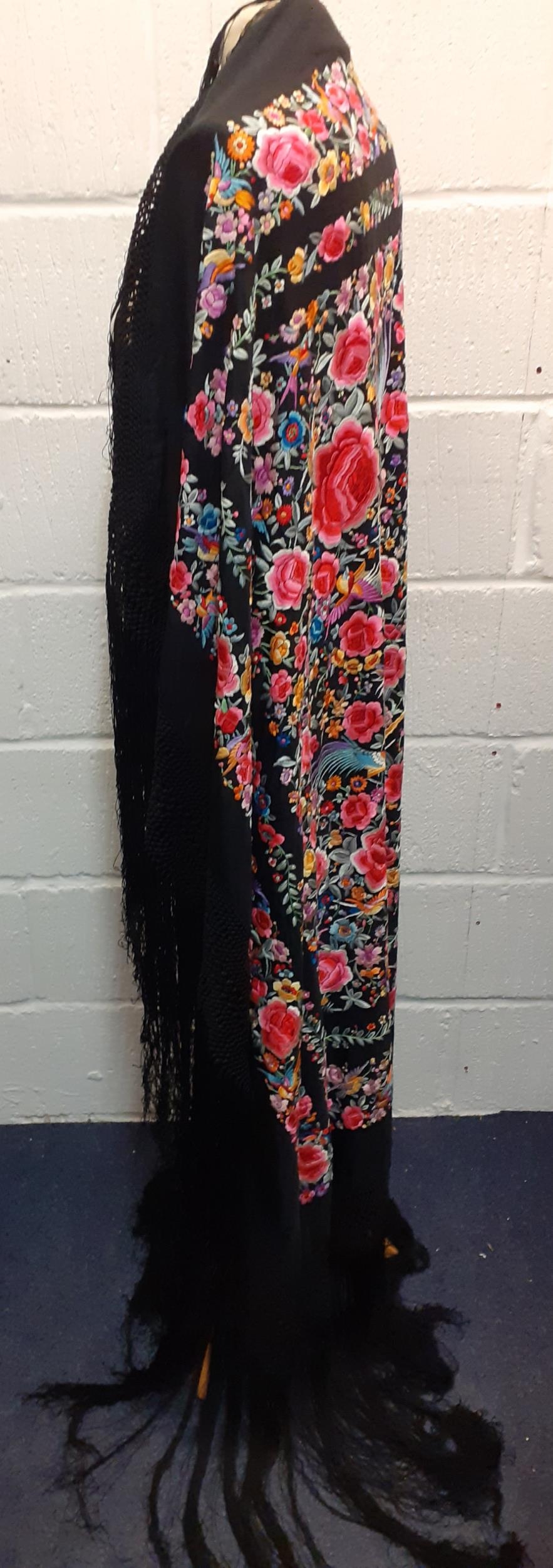 An early 20th century machine embroidered black Oriental shawl with vibrant images of roses, wild - Image 2 of 4