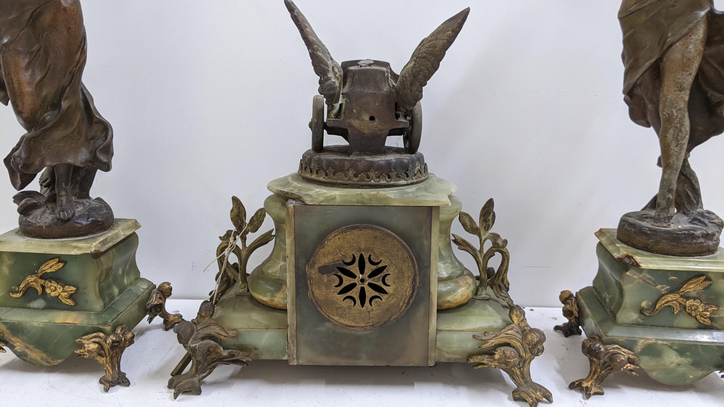 A late 19th century French onyx clock garniture set applied with gilt metal mounts and spelter - Image 3 of 5