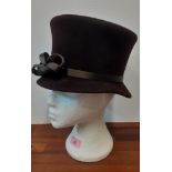 Philip Treacy- A ladies brown velour hat with brown satin double bow detail to the band, internal