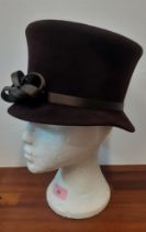 Philip Treacy- A ladies brown velour hat with brown satin double bow detail to the band, internal