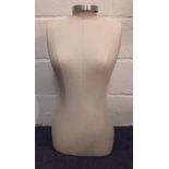 A fabric covered table top mannequin 28" High. Location:BWR If there is no condition report shown,