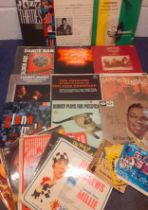 A quantity of mainly jazz and easy listening LP's and singles to include Glenn Miller, Nat King Cole