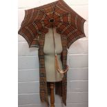 Burberrys-A 1970's tartan trench coat liner approx 36" chest together with a 1970's umbrella