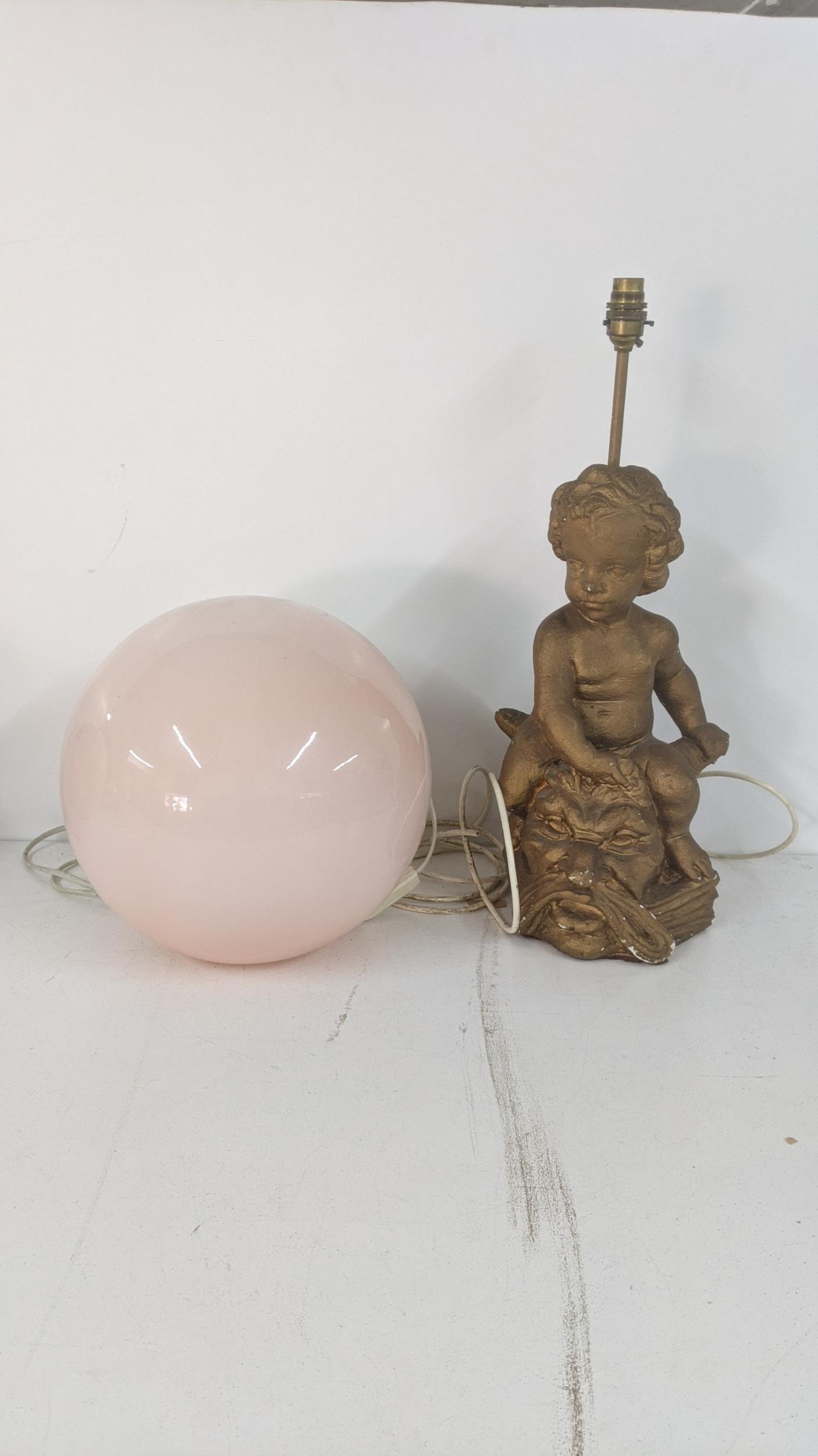 Two lamps to include one fashioned as a cherub painted gold, together with a retro style sphere lamp