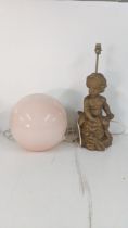 Two lamps to include one fashioned as a cherub painted gold, together with a retro style sphere lamp