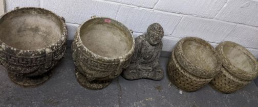 Two pairs of weathered concrete garden planters to include a pair on pedestal bases with raised