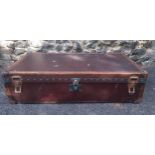 Louis Vuitton- An early 20th Century Louis Vuitton travel trunk, serial no:142412, having chestnut