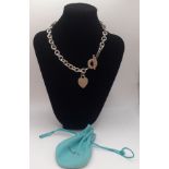 Tiffany & Co- A silver open chain necklace with heart tag inscribed with the initials ESD and