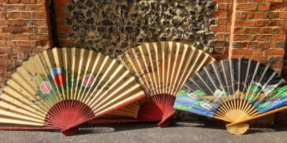 Three large ornamental Oriental inspired fans. Location:BWR Condition:Damage to one fan wand-see