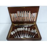A B & A Butterfield canteen of silver plated cutlery in a walnut veneered box Location: If there