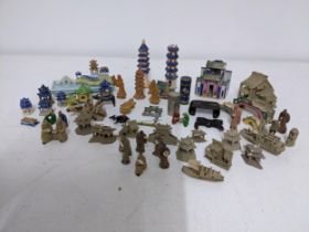 A collection of Chinese ceramic mudmen, buildings, bridges and pagodas figurines, a porcelain