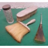 A Sterling silver handled brush and another, a silver topped glass dressing table pot and a button