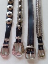 A group of 4 x 1980's black leather Western inspired/glam rock ladies belts with elaborate silver