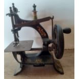 A small vintage toy cast iron hand cranked sewing machine 13cm wide x 17cm high. Location:R1.1 If