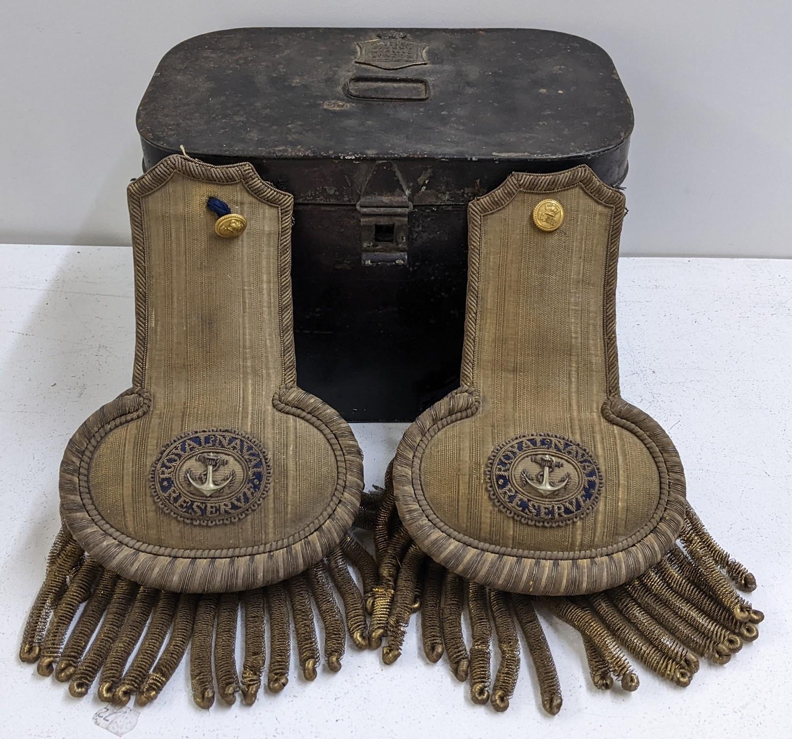 A cased pair of early 20th century Royal Navy Reserve officers dress epaulettes, the tin case