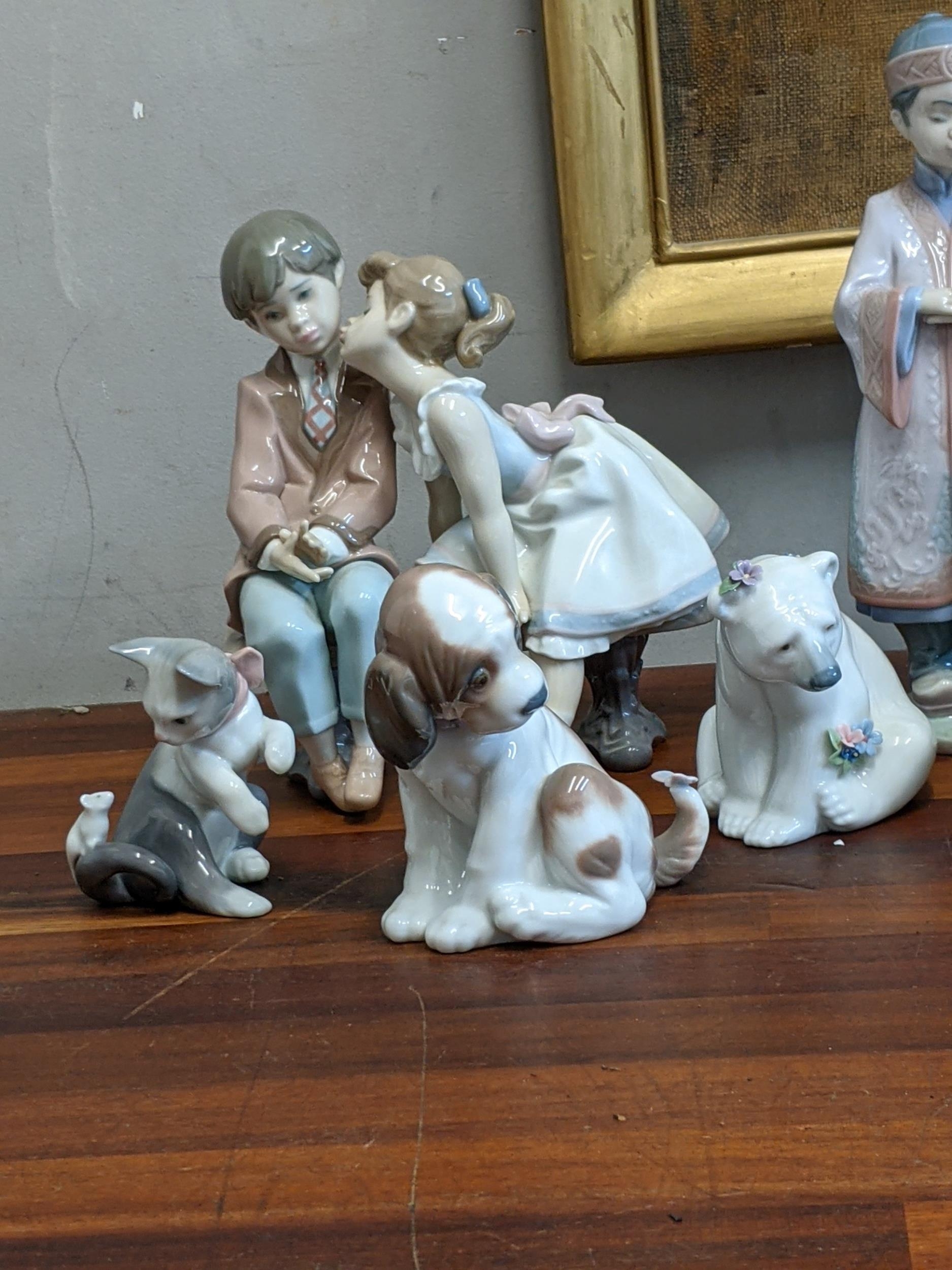 Seven Lladro figures to include a Kitten and Mouse, a Dog and Butterfly, a Polar Bear covered in - Image 2 of 4