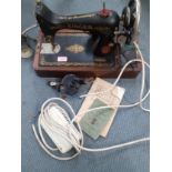 A 1929 99k Singer electric sewing machine A/F, serial number Y695604 having a domed case and oak