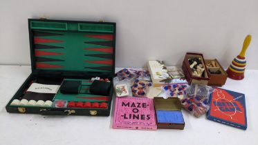 A mixed lot of games to include a chess set, playing cards, backgammon set and other items Location:
