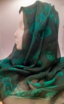 Alexander McQueen-A green chiffon scarf with images of skulls, 120cm x 100cm Location: R1.1