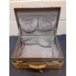 A vintage Mappin & Webb blue leather over-night case with brown cover, gold tone locks and blue