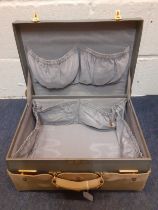 A vintage Mappin & Webb blue leather over-night case with brown cover, gold tone locks and blue