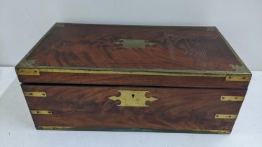 A 19th century mahogany and brass bound campaign writing slope with a fitted interior 18.5cmh x