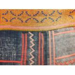 A hand woven tribal blanket/throw/wall covering having sections of yellow, blue, pink and orange