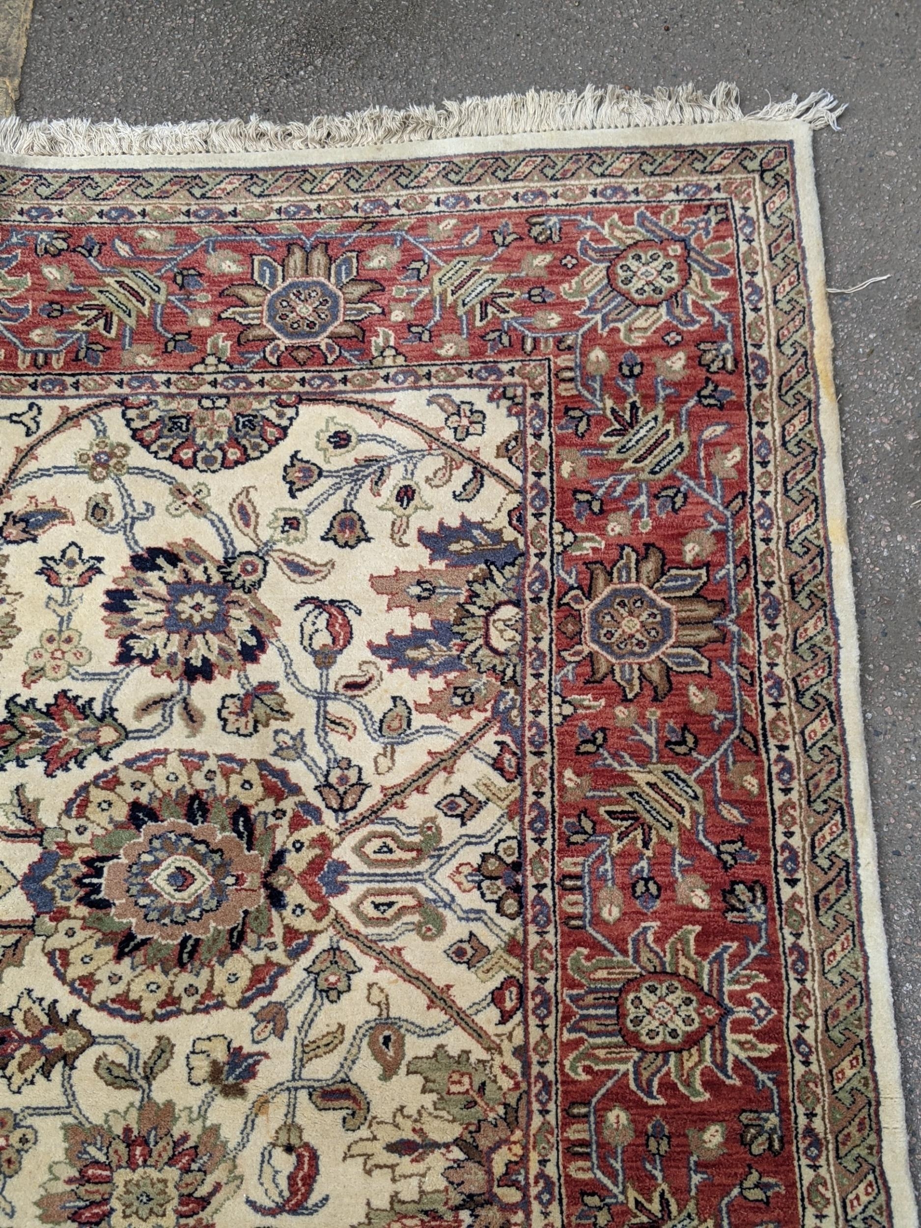 An antique Sharaen rug decorated symmetrically with four large medallions and four smaller ones on a - Image 6 of 9