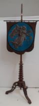 A Regency mahogany pole screen A/F with an embroidered screen depicting an image of a cherub and