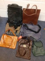 A quantity of mainly late 20th Century leather bags to include a Brazilian Roberto Santos green