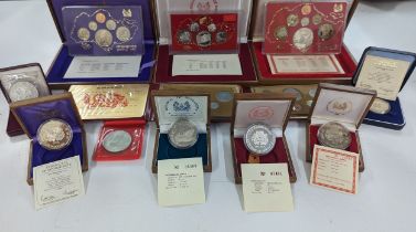Singapore - A collection of Proof and other coins to include three Silver $10, a $50 and $1, along