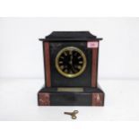 A French 19th century black slate and marble cased mantle clock the black dial with gilt Roman
