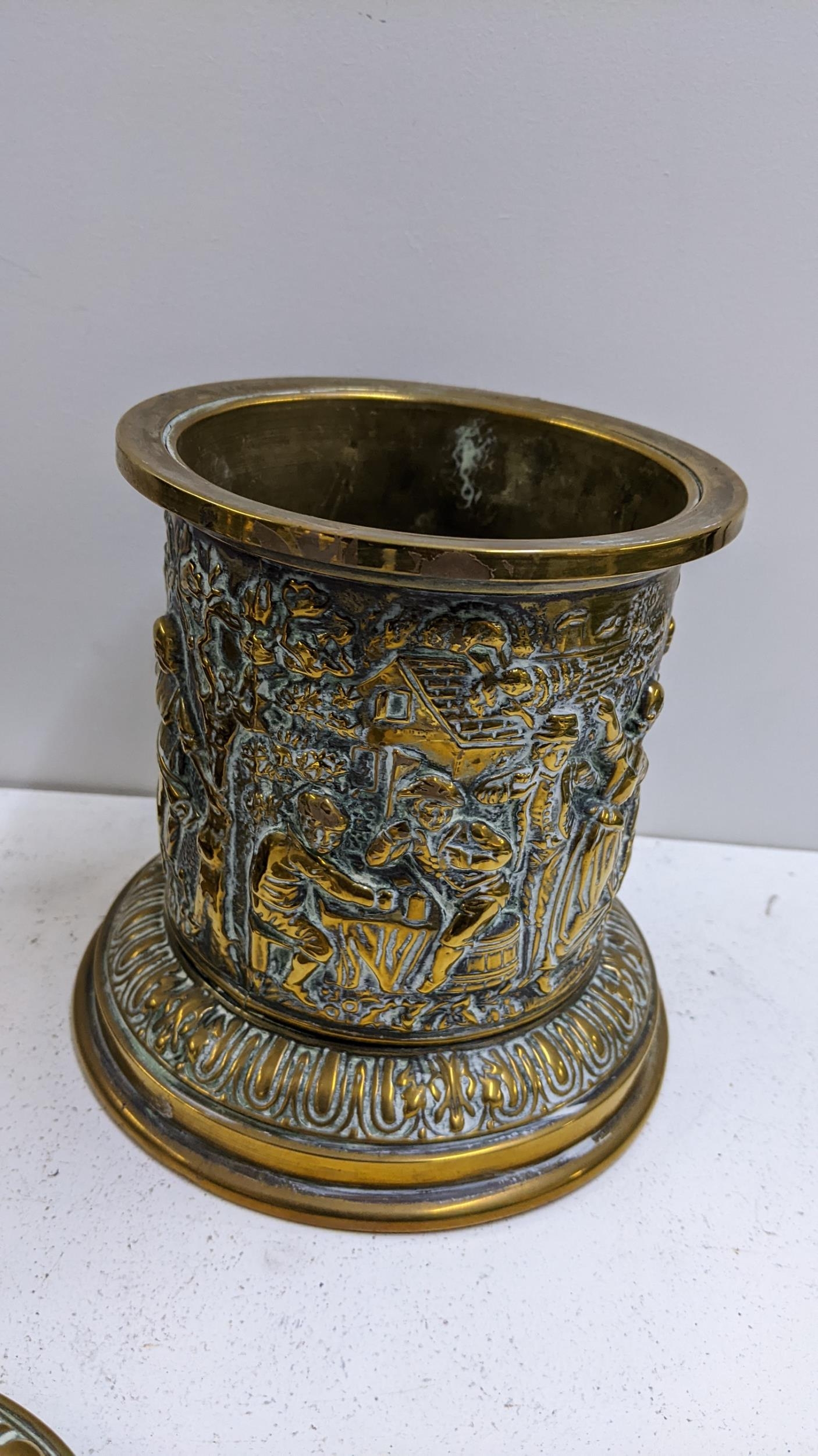 A late Victorian brass embossed tobacco jar, decorated with a continuous scene of figures, 18.5cm - Image 3 of 3