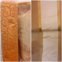 Three bolts of upholstery and curtain fabric to include a gold fabric swirl, a taupe leaf design and