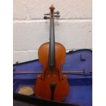 A reproduction Antonius Stradivarius violin with bow and accessories in a fitted case, back length