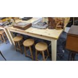 A modern pine kitchen table on painted block shaped legs 80h x 180w Location: RAM If there is no