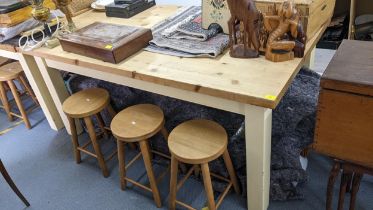 A modern pine kitchen table on painted block shaped legs 80h x 180w Location: RAM If there is no