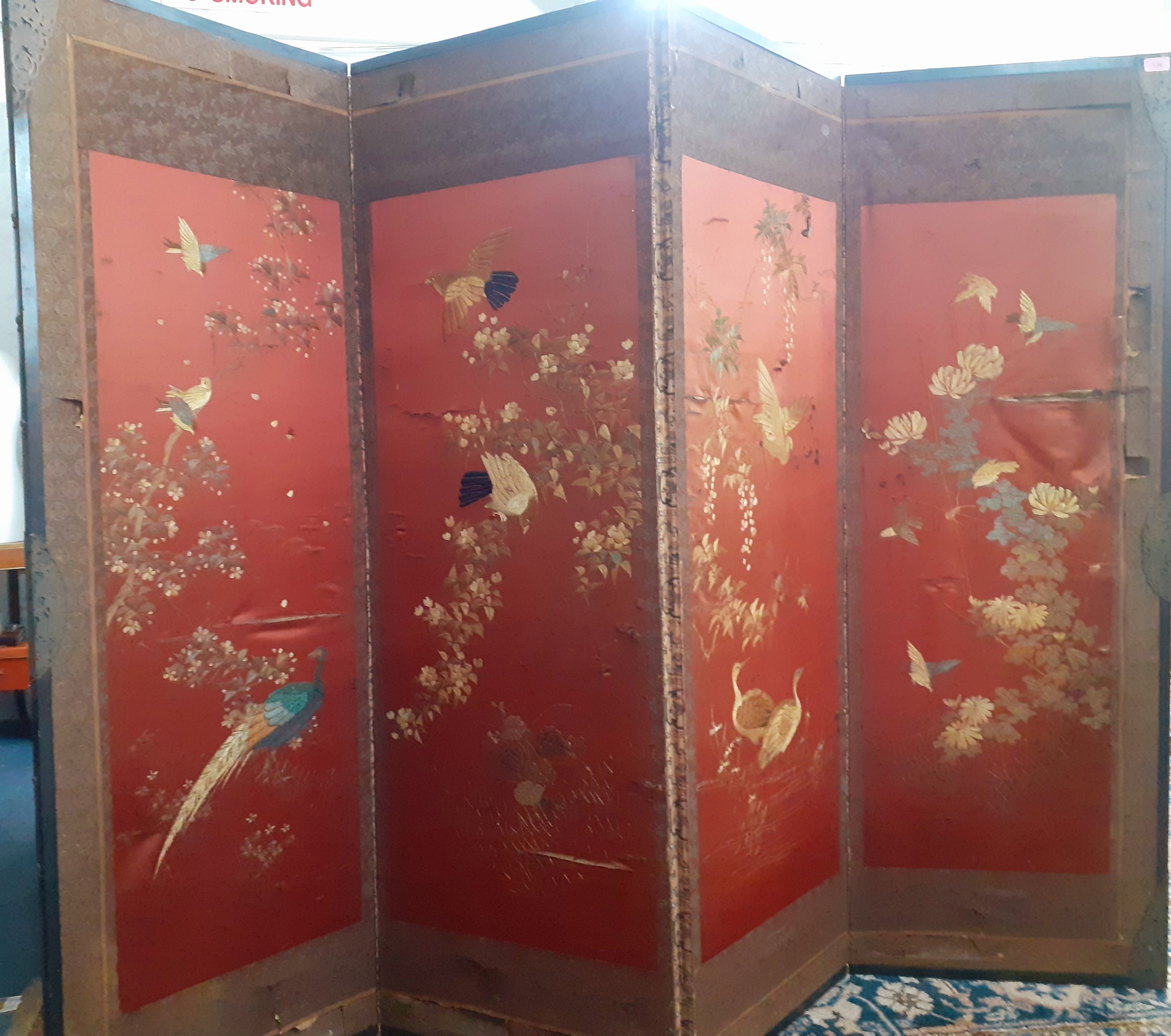 A 1930's Chinese 4 fold screen A/F having embroidered images of birds on branches of blossom to