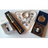 A small group of costume jewellery and collectables to include an engraved gold plated bangle with