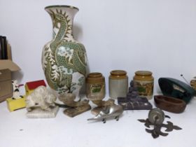 A mixed lot to include a carved alabaster model of a buffalo, painted wooden doghouse money bank,