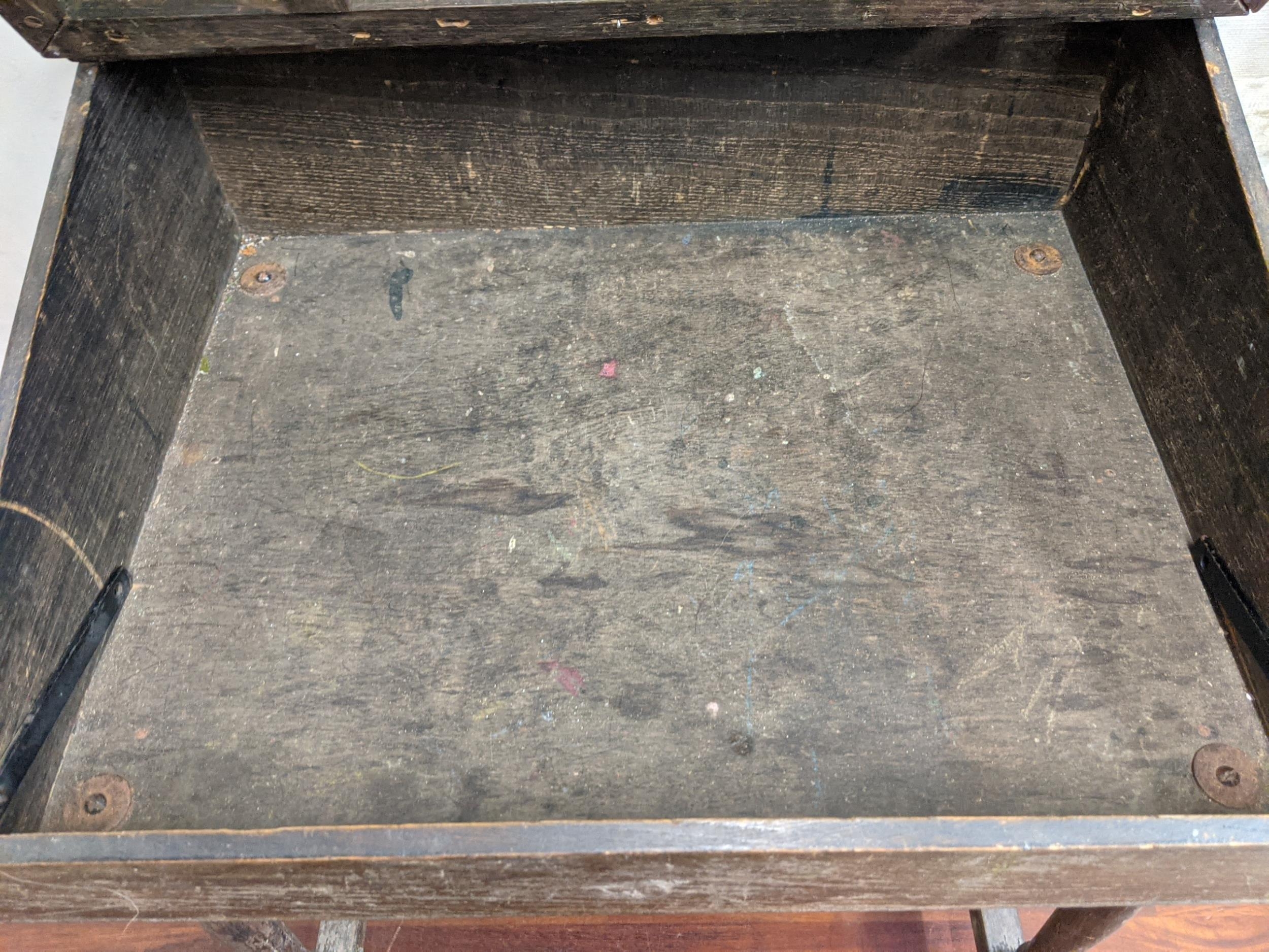 An early/mid 20th century child's desk with a hinged top, raised on tapered legs, united by a - Image 4 of 5