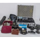 A collection of cameras and camera equipment to include a Minolta X-300 and XGI, SRT101b and