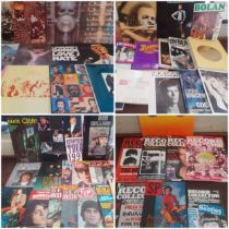 A quantity of 15 vintage LP's and music memorabilia to include The Who, Animals, David Bowie,