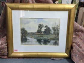 A watercolour depicting a river scene with a farmyard in the background, bearing signature 'Frank